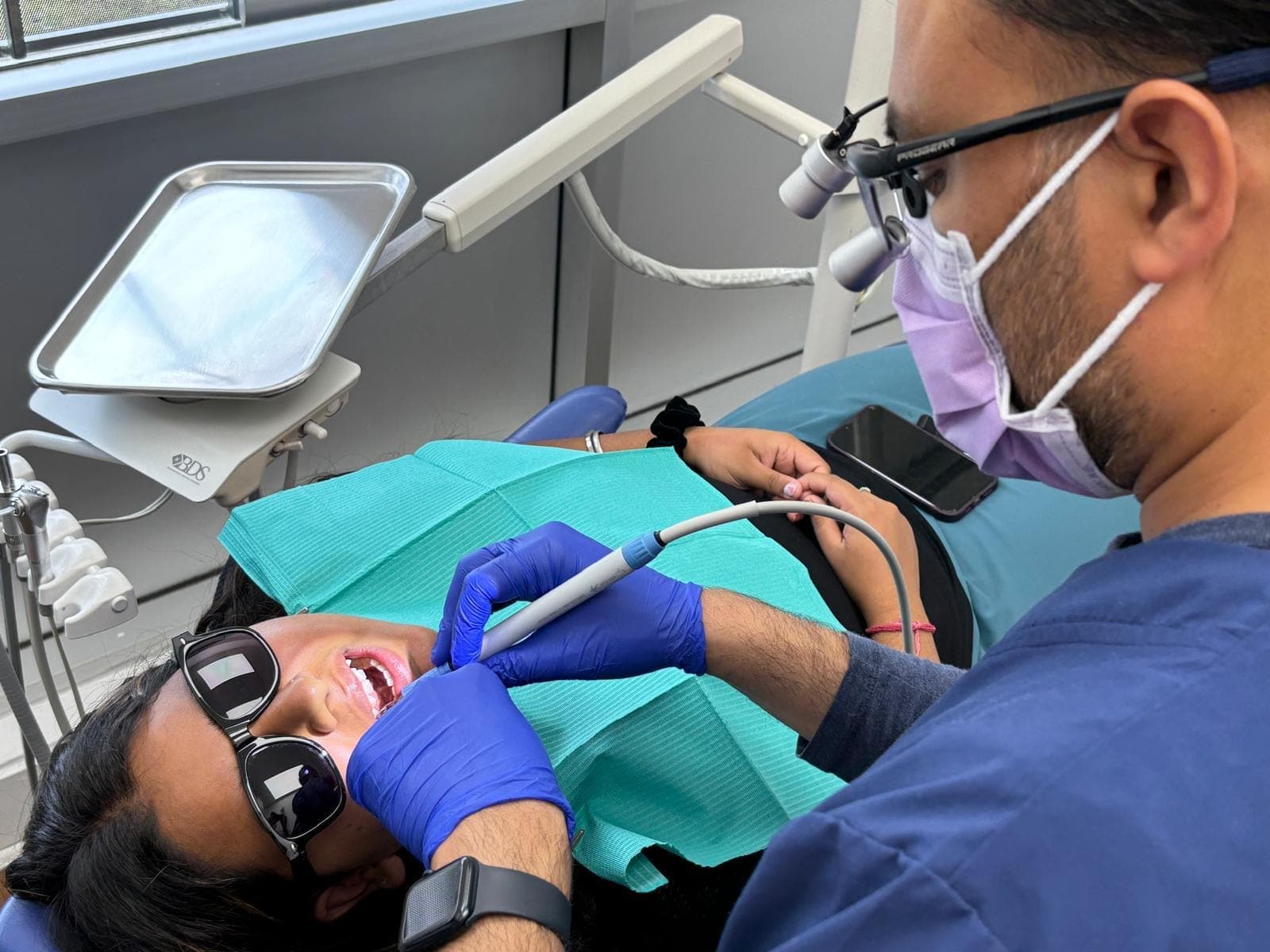 Dentist at Martindale Smiles performing a dental checkup and cleaning in NE Calgary